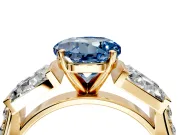 Channel-Set Engagement Ring Setting for Fancy Blue Round Cut Center with Baguette Band and Prong Head in Yellow Gold