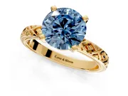 Solitaire Engagement Ring Setting for Fancy Blue Round Cut Center with Milgrain X Pattern Band and Prong Head in Yellow Gold