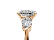 3 Stone Engagement Ring Setting for Radiant Cut Center with Large Pear-Shaped Accents and Prong Head in Rose Gold