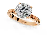 Solitaire Engagement Ring Setting for Round Cut Center with Scrollwork Band and Prong Head in Rose Gold