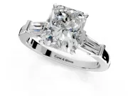 3 Stone Engagement Ring Setting for Radiant Cut Center with Channel Baguette Accents and Prong Head in Platinum