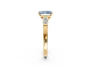 3 Stone Engagement Ring Setting for Fancy Blue Radiant Cut Center with Channel Baguette Accents and Prong Head in Yellow Gold