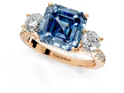 3 Stone Engagement Ring Setting for Fancy Blue Asscher Cut Center with Crossover Basket, Pave Band and Prong Head in Rose Gold