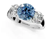 3 Stone Engagement Ring Setting for Fancy Blue Round Cut Center with Raised Basket Heads and Prong Head in Platinum