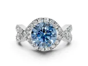 Halo Engagement Ring Setting for Fancy Blue Round Cut Center with Pave Infinity Twist Band and Prong Head in Platinum