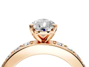Solitaire Engagement Ring Setting for Pear-Shaped Center with Channel-Set Accents and Prong Head in Rose Gold