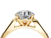 Solitaire Engagement Ring Setting for Round Cut Center with Channel Accents and Prong Head in Yellow Gold