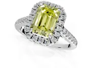 Halo Engagement Ring Setting for Fancy Yellow Emerald Cut Center with Narrowing Pave Band and Prong Head in Platinum