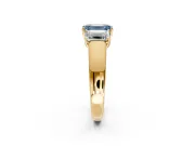 3 Stone Engagement Ring Setting for Fancy Blue Emerald Cut Center with Raised Basket Heads and Prong Head in Yellow Gold