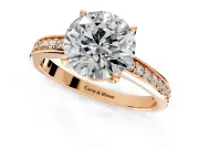 Solitaire Engagement Ring Setting for Round Cut Center with Channel-Set Accent Band and Prong Head in Rose Gold