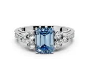 Cluster Engagement Ring Setting for Fancy Blue Emerald Cut Center with Bezel Accent Clusters and Prong Head in White Gold