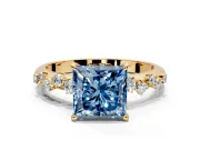 Cluster Engagement Ring Setting for Fancy Blue Princess Cut Center with Round Cut Accent Band and Prong Head in Yellow Gold