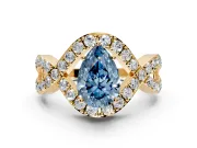 Halo Engagement Ring Setting for Fancy Blue Pear-Shaped Center with Pave Infinity Twist Band and Prong Head in Yellow Gold