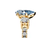 3 Stone Engagement Ring Setting for Fancy Blue Pear-Shaped Center with Round Cut Side Accents and Prong Head in Yellow Gold