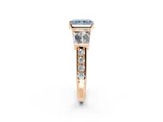 Channel-Set Engagement Ring Setting for Fancy Blue Radiant Cut Center with Baguette Band and Prong Head in Rose Gold