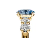 5 Stone Engagement Ring Setting for Fancy Blue Oval Center with Graduated Accents and Prong Head in Yellow Gold