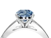 Solitaire Engagement Ring Setting for Fancy Blue Cushion Cut Center with Princess Cut Channel Band and Prong Head in White Gold