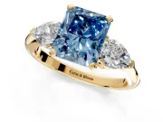 3 Stone Engagement Ring Setting for Fancy Blue Radiant Cut Center with Large Pear-Shaped Accents and Prong Head in Yellow Gold