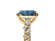 Solitaire Engagement Ring Setting for Fancy Blue Emerald Cut Center with Trailing Leaf Accent Band and Prong Head in Yellow Gold