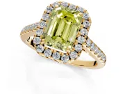 Halo Engagement Ring Setting for Fancy Yellow Emerald Cut Center with Narrowing Pave Band and Prong Head in Yellow Gold