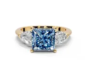 3 Stone Engagement Ring Setting for Fancy Blue Princess Cut Center with Large Pear-Shaped Accents and Prong Head in Yellow Gold