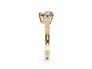 3 Stone Engagement Ring Setting for Heart-Shaped Center with Baguette Accents and Prong Head in Yellow Gold