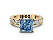 Solitaire Engagement Ring Setting for Fancy Blue Princess Cut Center with Channel-Set Accents and Prong Head in Yellow Gold
