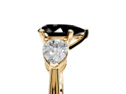 3 Stone Engagement Ring Setting for Fancy Black Pear-Shaped Center with Large Pear-Shaped Accents and Prong Head in Yellow Gold