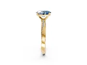 Side Accent Engagement Ring Setting for Fancy Blue Oval Center with Accent Shoulders and Prong Head in Yellow Gold