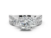 3 Stone Engagement Ring Setting for Cushion Cut Center with Pave Twist Band and Prong Head in Platinum