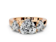 3 Stone Engagement Ring Setting for Heart-Shaped Center with Raised Basket Heads and Prong Head in Rose Gold