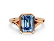 Solitaire Engagement Ring Setting for Fancy Blue Emerald Cut Center with V Split Shank and Bezel Head in Rose Gold