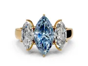 3 Stone Engagement Ring Setting for Fancy Blue Marquise Center with Raised Basket Heads and Prong Head in Yellow Gold