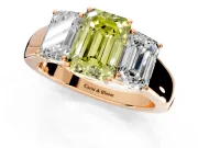 3 Stone Engagement Ring Setting for Fancy Yellow Emerald Cut Center with Raised Basket Heads and Prong Head in Rose Gold