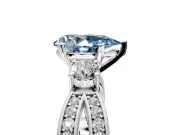 3 Stone Engagement Ring Setting for Fancy Blue Pear-Shaped Center with Pave Twist Band and Prong Head in Platinum