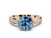 Solitaire Engagement Ring Setting for Fancy Blue Round Cut Center with Princess Cut Channel Band and Prong Head in Rose Gold