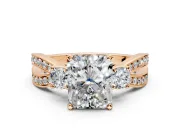 3 Stone Engagement Ring Setting for Radiant Cut Center with Pave Twist Band and Prong Head in Rose Gold