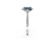 Halo Engagement Ring Setting for Fancy Blue Emerald Cut Center with Pave Accents, Heart Basket and Prong Head in Platinum