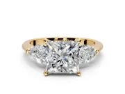 3 Stone Engagement Ring Setting for Princess Cut Center with Large Pear-Shaped Accents and Prong Head in Yellow Gold
