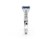 Solitaire Engagement Ring Setting for Fancy Blue Emerald Cut Center with Round Cut Channel Band and Prong Head in Sterling Silver