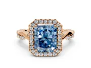 Halo Engagement Ring Setting for Fancy Blue Radiant Cut Center with Twist Band and Prong Head in Rose Gold