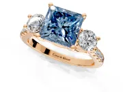 3 Stone Engagement Ring Setting for Fancy Blue Princess Cut Center with Crossover Basket, Pave Band and Prong Head in Rose Gold