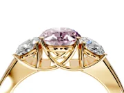3 Stone Engagement Ring Setting for Fancy Pink Oval Center with Raised Basket Heads and Prong Head in Yellow Gold