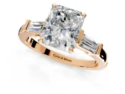 3 Stone Engagement Ring Setting for Radiant Cut Center with Channel Baguette Accents and Prong Head in Rose Gold