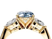3 Stone Engagement Ring Setting for Fancy Blue Oval Center with Large Pear-Shaped Accents and Prong Head in Yellow Gold
