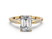 Solitaire Engagement Ring Setting for Emerald Cut Center with Channel Accents and Prong Head in Yellow Gold