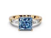 3 Stone Engagement Ring Setting for Fancy Blue Princess Cut Center with Tapered Baguettes, Plain Band and Prong Head in Yellow Gold
