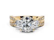 3 Stone Engagement Ring Setting for Round Cut Center with Pave Twist Band and Prong Head in Yellow Gold