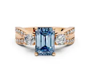 3 Stone Engagement Ring Setting for Fancy Blue Emerald Cut Center with Pave Twist Band and Prong Head in Rose Gold