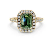 Halo Engagement Ring Setting for Fancy Green Emerald Cut Center with Narrowing Pave Band and Prong Head in Yellow Gold